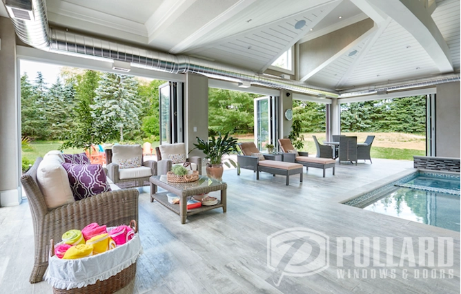 Photo of outdoor living space with tables, chairs, and PanaView Folding Doors