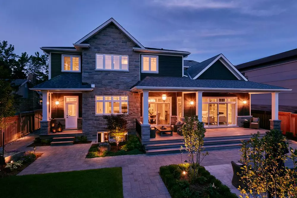 Custom home build with casement windows - backyard view on brick hosue