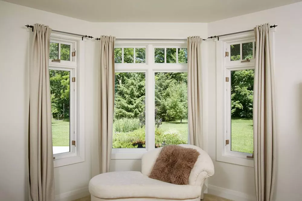 Casement windows with white vinyl frame