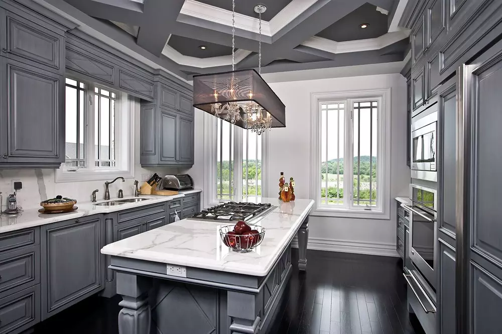 Gray color modern kitchen with black floors and casement windows