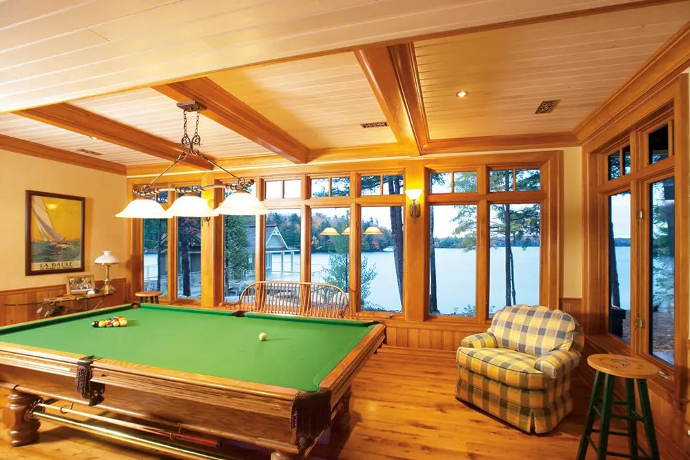Large windows in billiards room by the lake