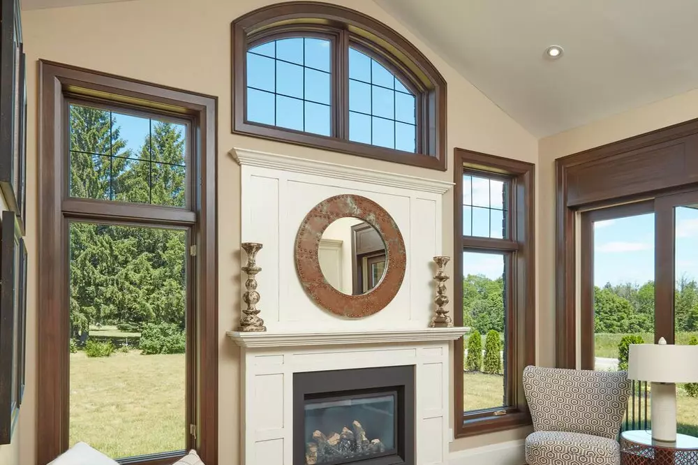 Decorative and casement windows installed above fireplace