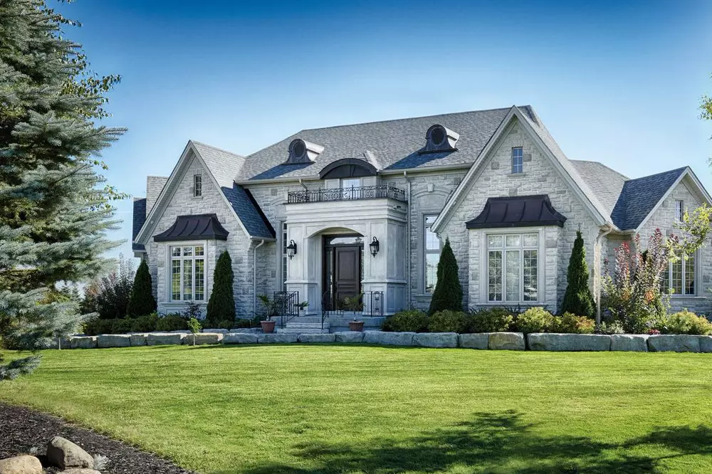 Exterior view of vinyl windows on custom build home - decorative windows