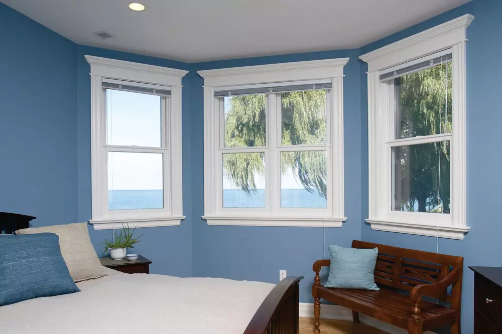 Light blue bedroom with new double hung windows