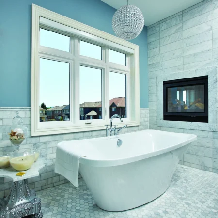 A bathroom with picture and casement windows