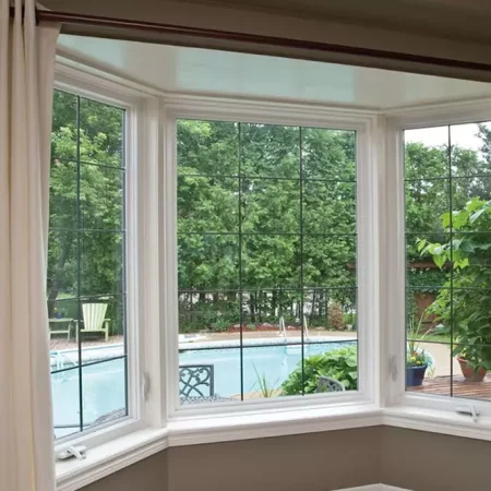 Photo of bay-bow window looking out at backyard with pool