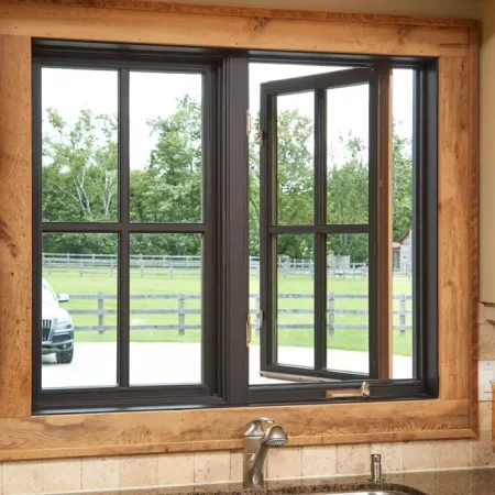 Black casement window slightly open in kitchen above sink