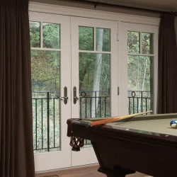 pool table inside room with French doors leading to balcony