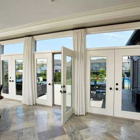 Beautiful image of white terrace doors leading to back deck - open view