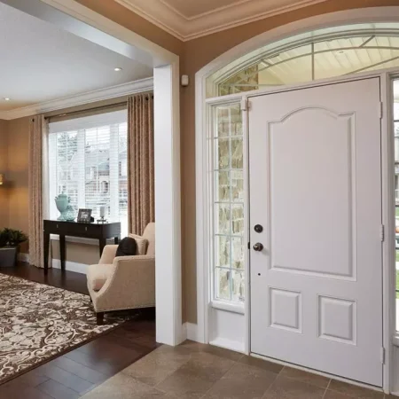 front foyer of home with main entrance steel doors in white colour with side lights