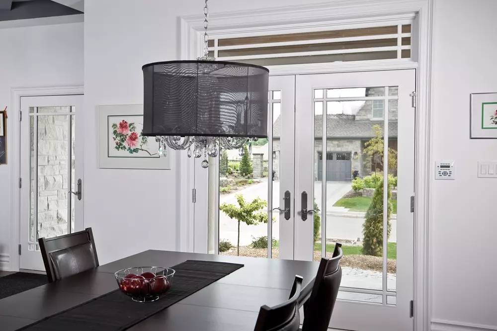 dining room with white entrance terrace doors with built-in windows