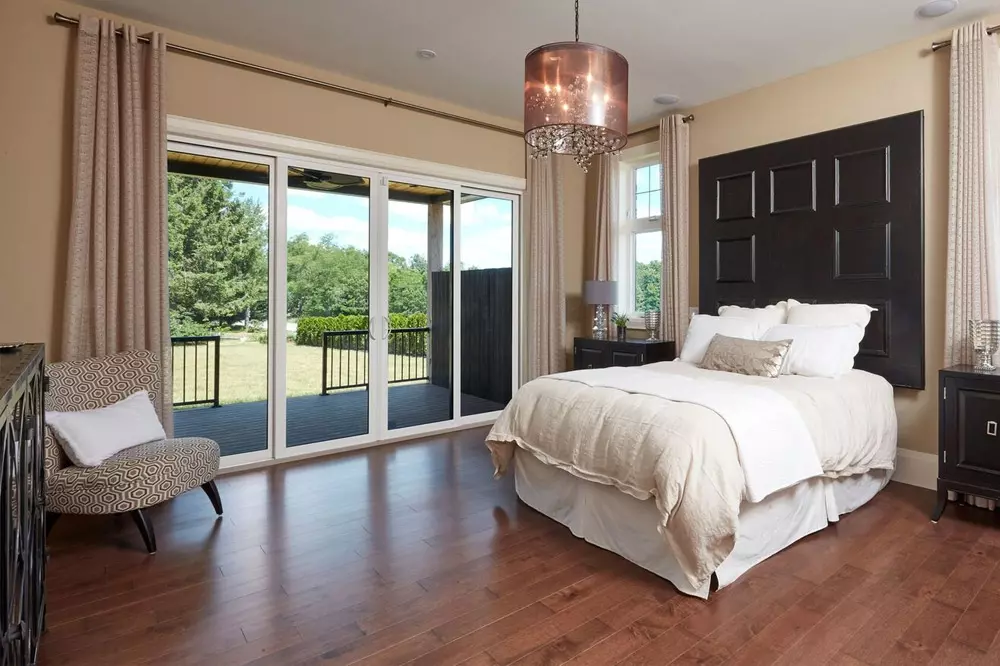 master bedroom with sliding patio doors leading to back deck